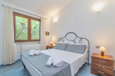 Letto o letti in una camera di Villas with air conditioning and private outdoor area just 400 meters from the beach