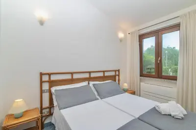 Letto o letti in una camera di Villas with air conditioning and private outdoor area just 400 meters from the beach
