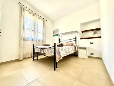 Letto o letti in una camera di Beach Houses