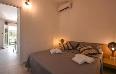 Letto o letti in una camera di Bilocale
