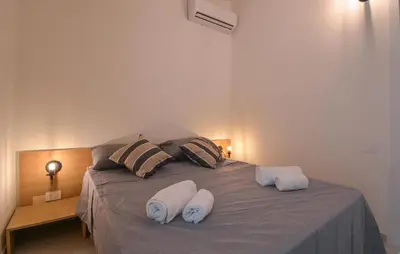 Letto o letti in una camera di Bilocale