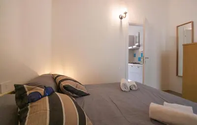 Letto o letti in una camera di Bilocale
