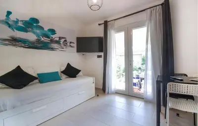 Letto o letti in una camera di Bilocale
