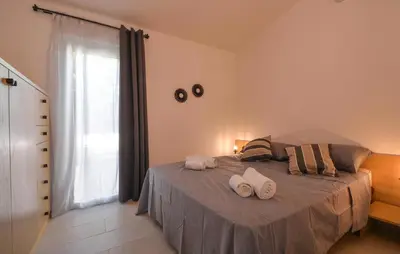 Letto o letti in una camera di Bilocale
