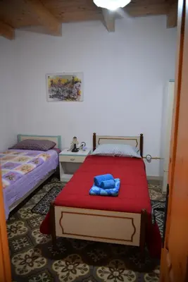 Letto o letti in una camera di Bacco casa vacanze