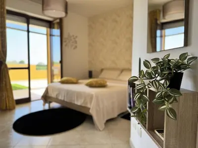 Letto o letti in una camera di AgoRa Family House