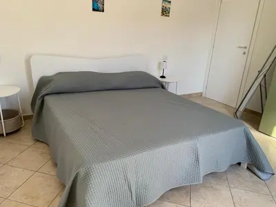 Letto o letti in una camera di Casa vacanza Mamaioa