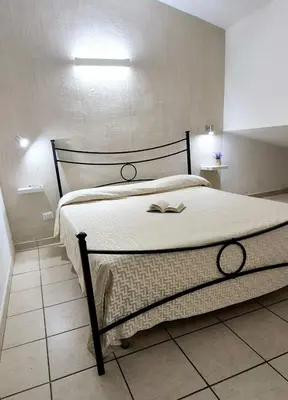 Letto o letti in una camera di Villetta al mare Sa Babbaiola