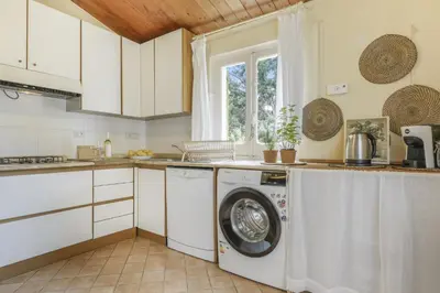 Cucina o angolo cottura di Villa La Scuderia I Unique Beachfront Villa