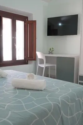 Letto o letti in una camera di B&B Aquas