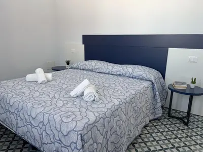 Letto o letti in una camera di B&B Aquas
