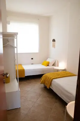 Letto o letti in una camera di Sunshine Apartment - Appartamento Vicino al Mare, Cagliari, Sardinia