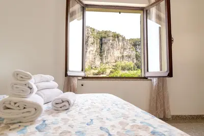 Letto o letti in una camera di Sa Omu de Virgiliu - Affitti Brevi Italia