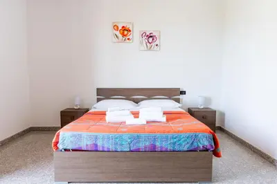 Letto o letti in una camera di Sa Omu de Virgiliu - Affitti Brevi Italia