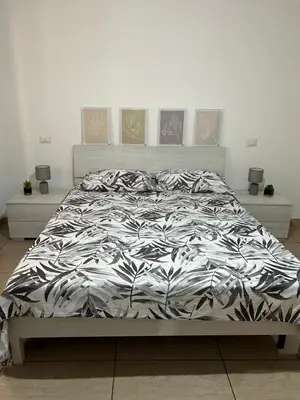 Letto o letti in una camera di Casa A
