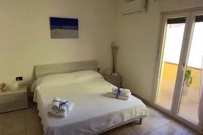 Letto o letti in una camera di Marida - Dimora moderna in centro storico