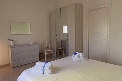 Letto o letti in una camera di Marida - Dimora moderna in centro storico