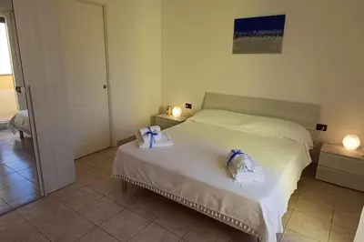 Letto o letti in una camera di Marida - Dimora moderna in centro storico