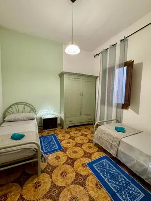 Letto o letti in una camera di House Le Gallinelle