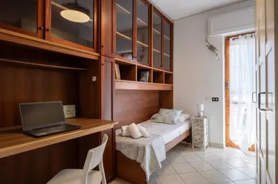 Letto o letti in una camera di 5 minuti dal mare e Parco naturale- casa moderna con veranda