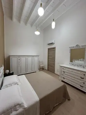 Letto o letti in una camera di casa di Lorenzino