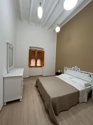 Letto o letti in una camera di casa di Lorenzino