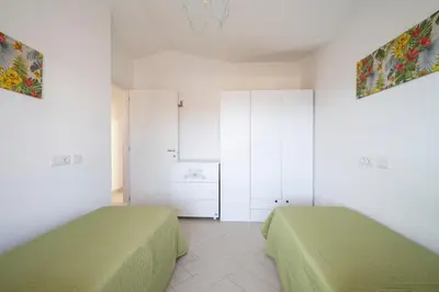 Letto o letti in una camera di Attico panoramico a Tortolì