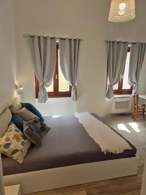 Letto o letti in una camera di Domu MariaLuisa