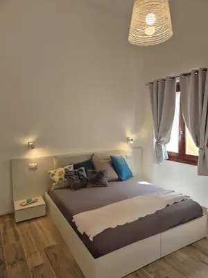 Letto o letti in una camera di Domu MariaLuisa