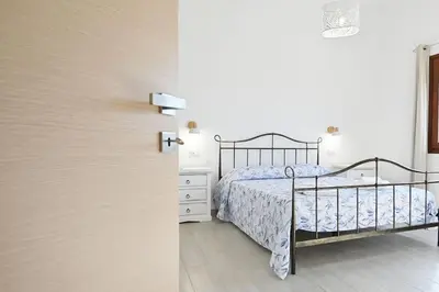 Letto o letti in una camera di Villa della Monica Pure relax