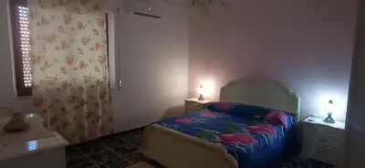 Letto o letti in una camera di Casa Maria
