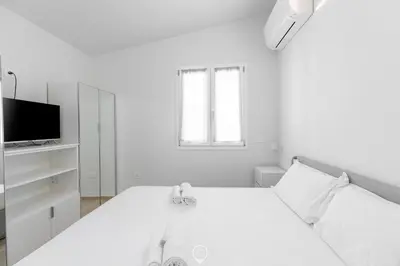 Letto o letti in una camera di White Magnolia Apt