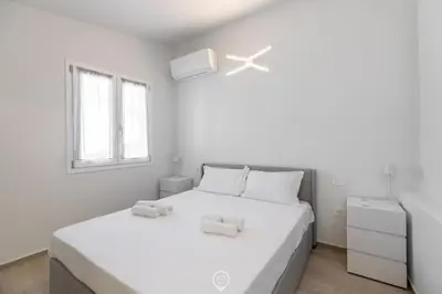 Letto o letti in una camera di White Magnolia Apt