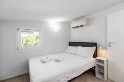 Letto o letti in una camera di White Magnolia Apt