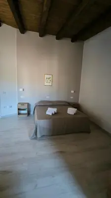 Letto o letti in una camera di L'Ulivo Affittacamere Gonnosfanadiga