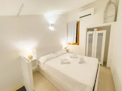 Letto o letti in una camera di Orizzonte Azzurro, vista mare