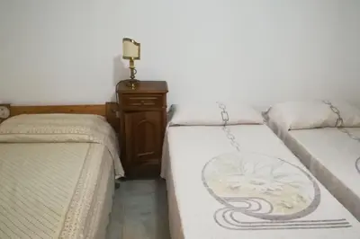 Letto o letti in una camera di Taverna Albachiara
