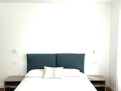 Letto o letti in una camera di Mamas