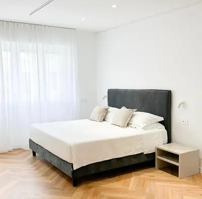 Letto o letti in una camera di Mamas