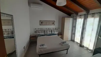 Letto o letti in una camera di Villa delle Fresie B&B