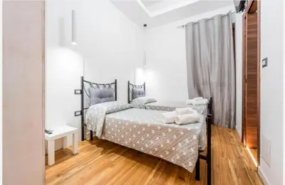 Letto o letti in una camera di Colombo House
