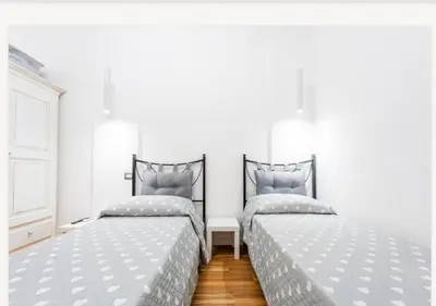Letto o letti in una camera di Colombo House