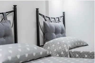 Letto o letti in una camera di Colombo House