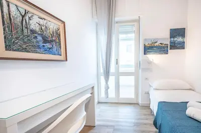 Letto o letti in una camera di Flamingo Poetto mare a due passi