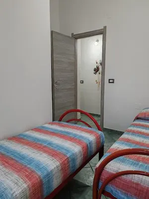 Letto o letti in una camera di La Mimosa Bianca