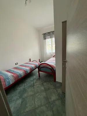 Letto o letti in una camera di La Mimosa Bianca