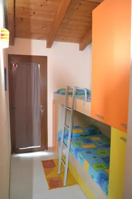 Letto o letti in una camera di Casa del Tramonto Pistis