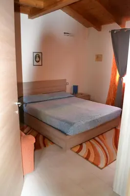 Letto o letti in una camera di Casa del Tramonto Pistis