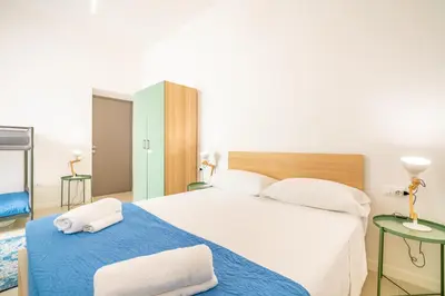 Letto o letti in una camera di Stanze Victoria in Marina