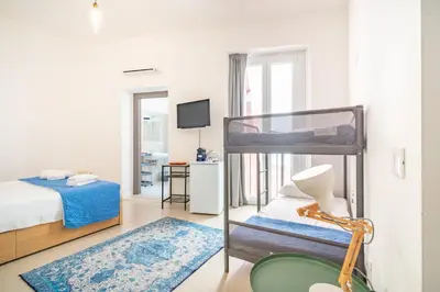 Letto o letti in una camera di Stanze Victoria in Marina